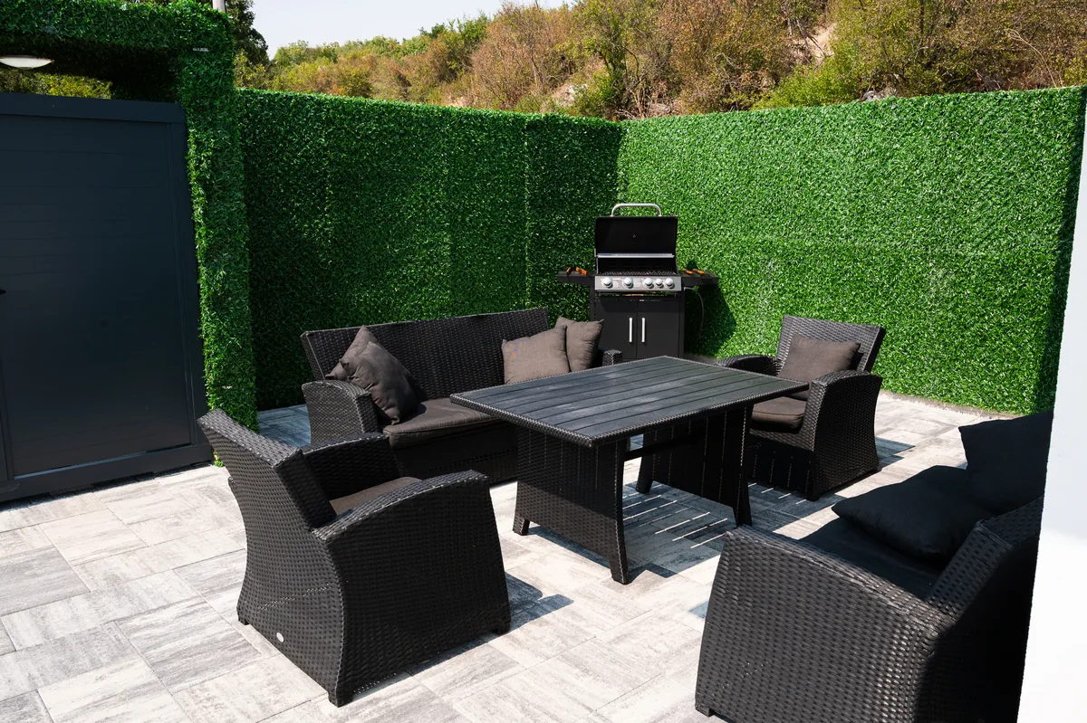 Outdoor grill area with dining set