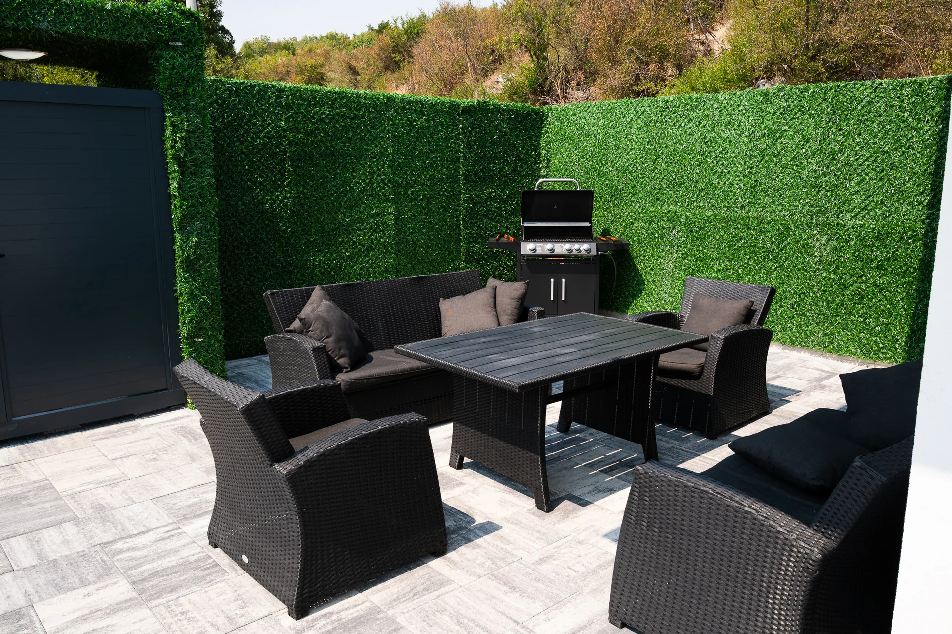 Outdoor grill and dining set in the evening