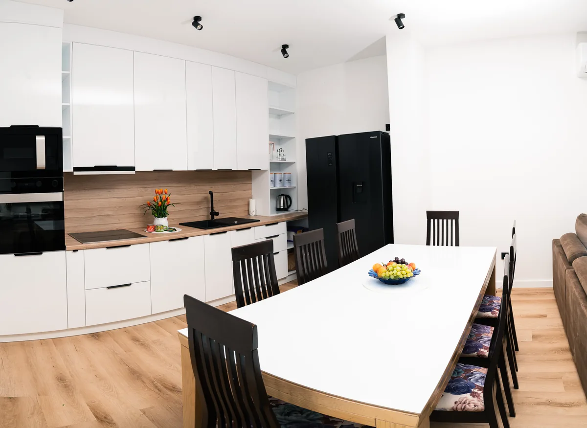 Shared kitchen and large group dining table