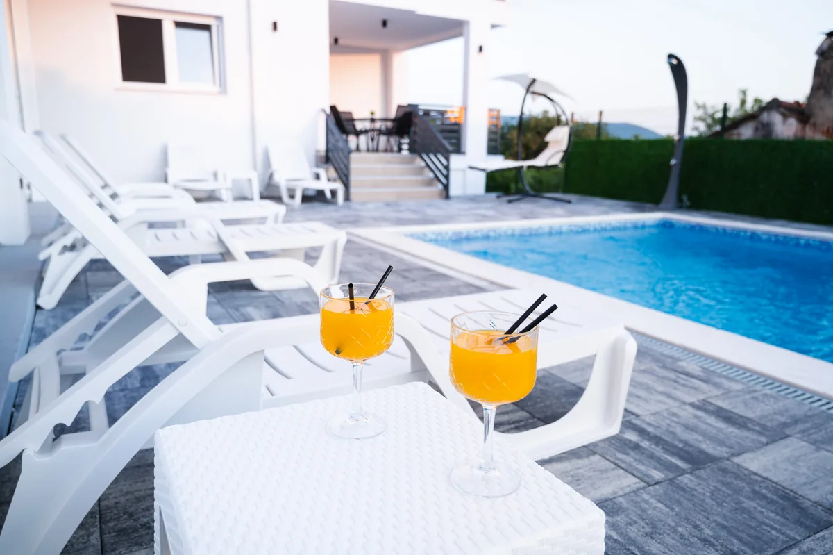 Cocktails on a side table by the pool
